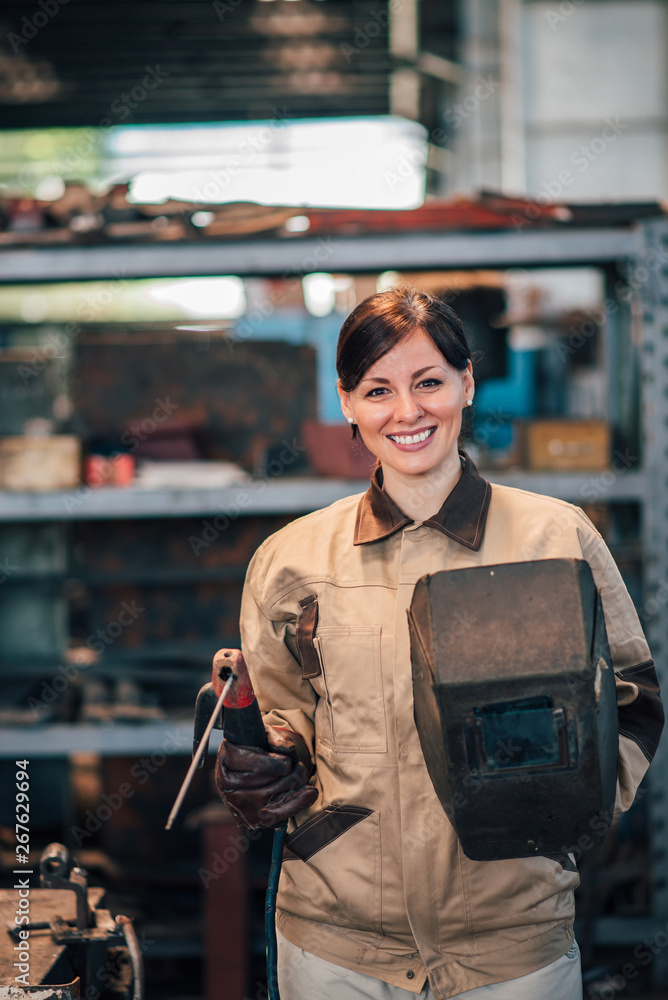 Portrait of a female welder at the factory.