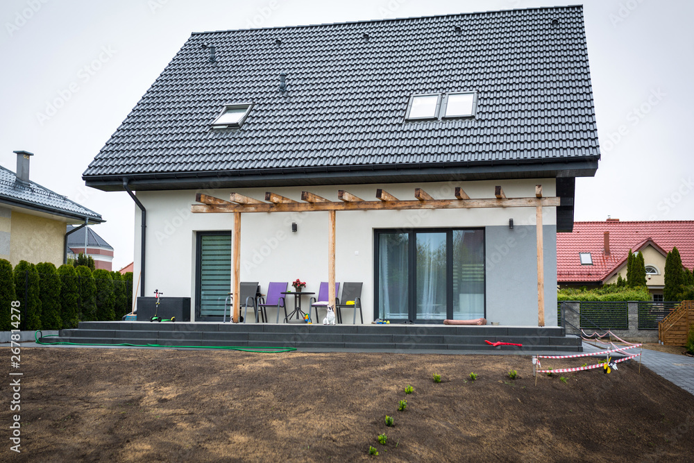 House with grass seeds planted for the perfect lawn
