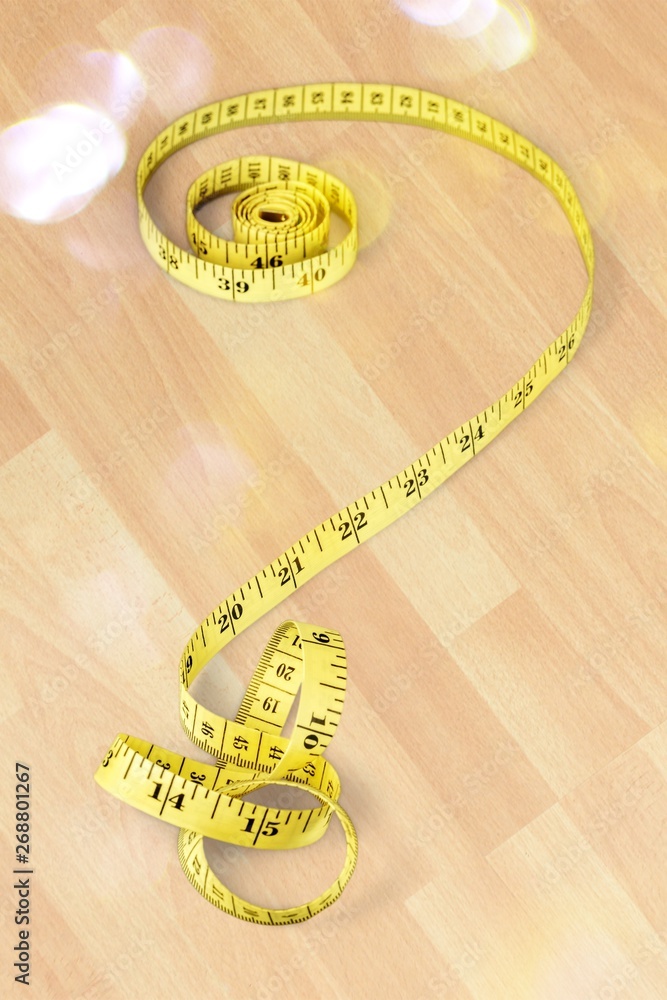 Tape measure forming the shape of question mark