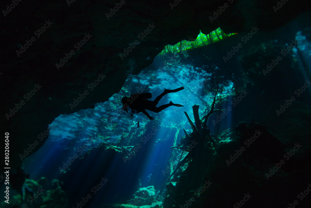 Diving in the cenote underwater cave, Quintana roo