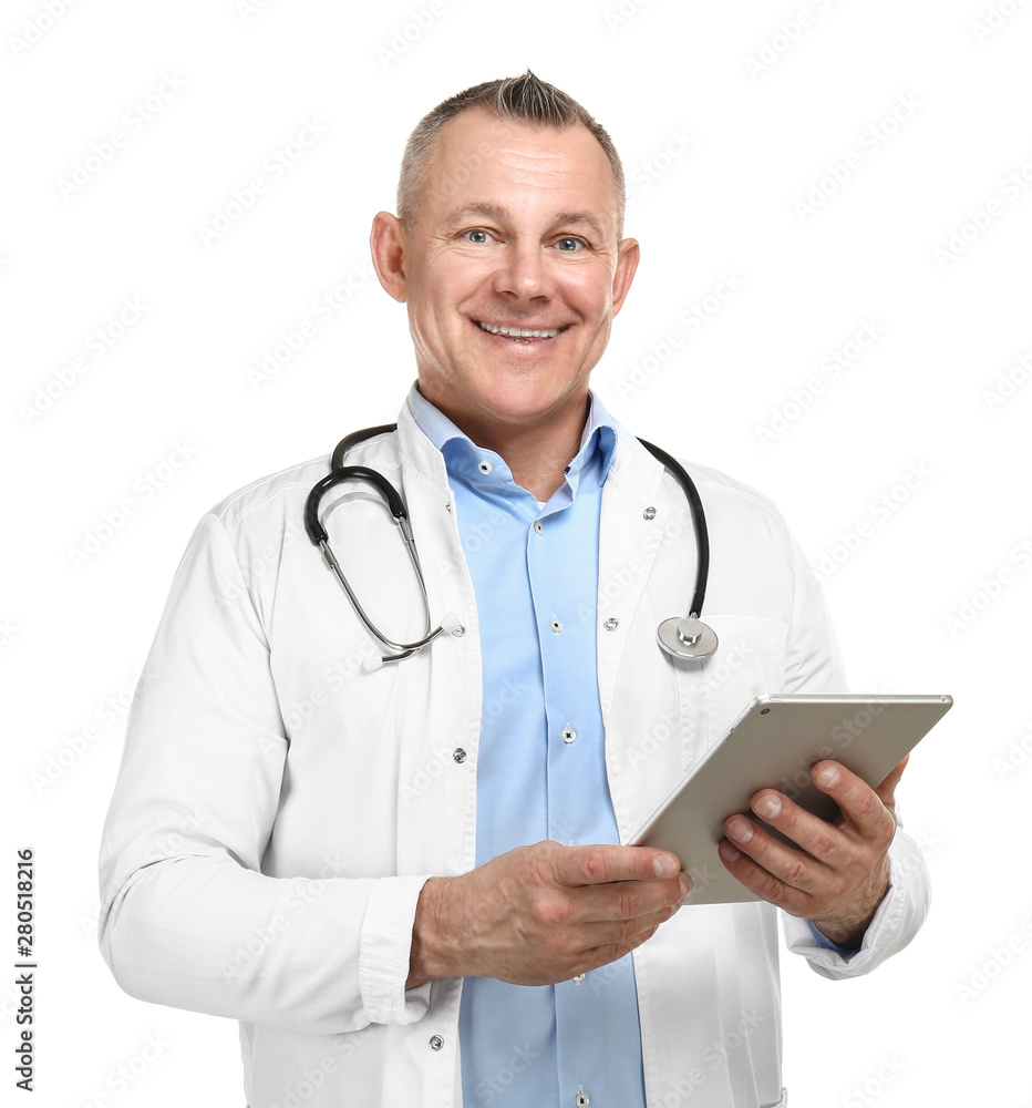 Handsome middle-aged doctor with tablet PC on white background