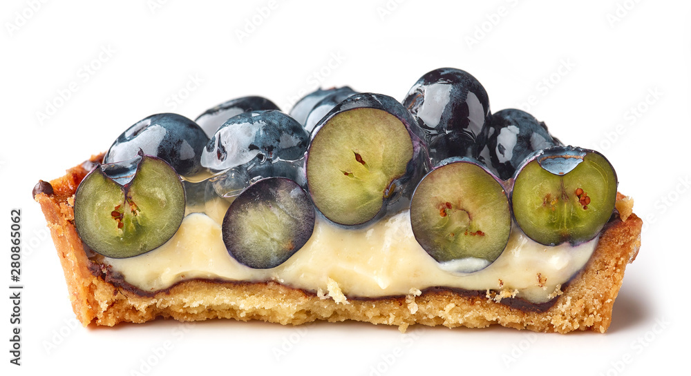 half of blueberry tart on white background