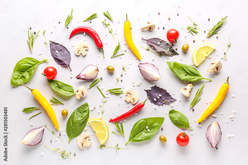 Fresh herbs with vegetables and spices on white background