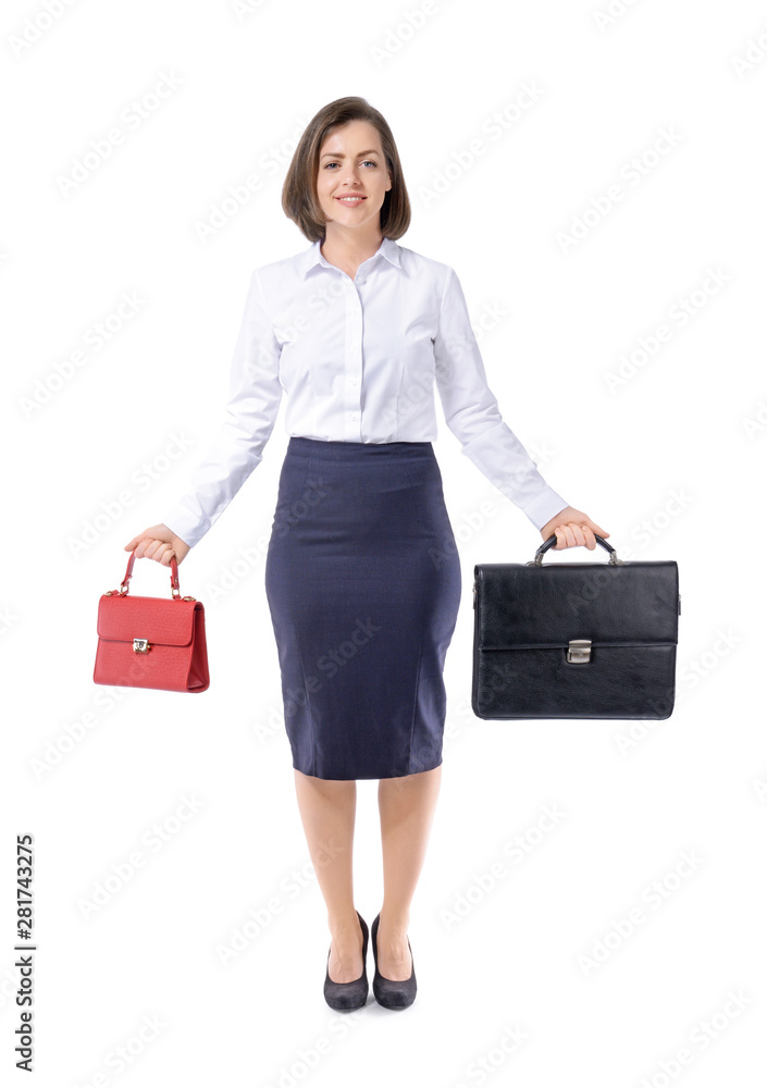 Young businesswoman with different bags on white background. Concept of balance between work and lei