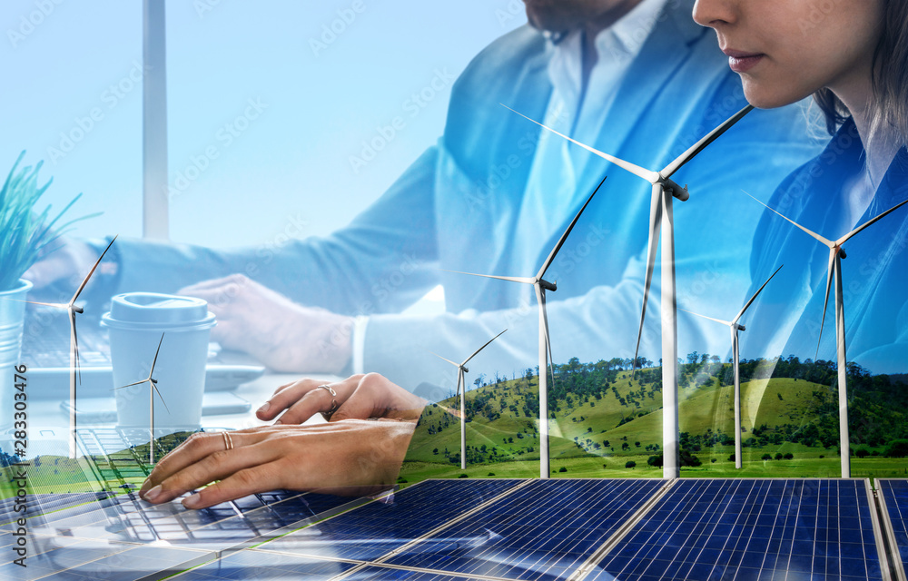 商界人士在风电场和绿色可再生能源领域工作的双重曝光图