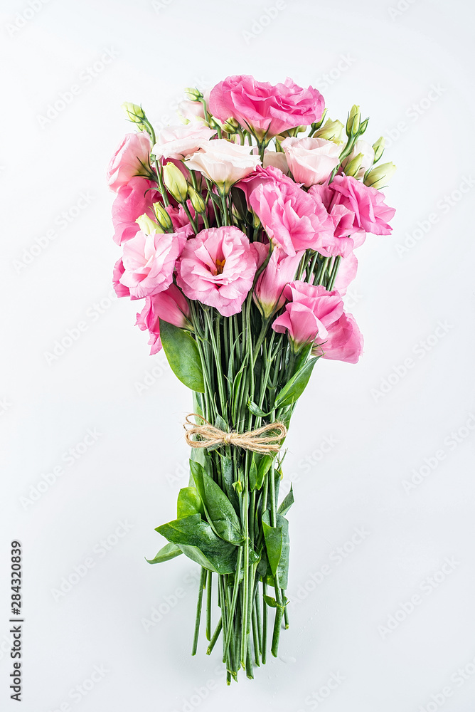 A bouquet of flowers eustoma on a white background
