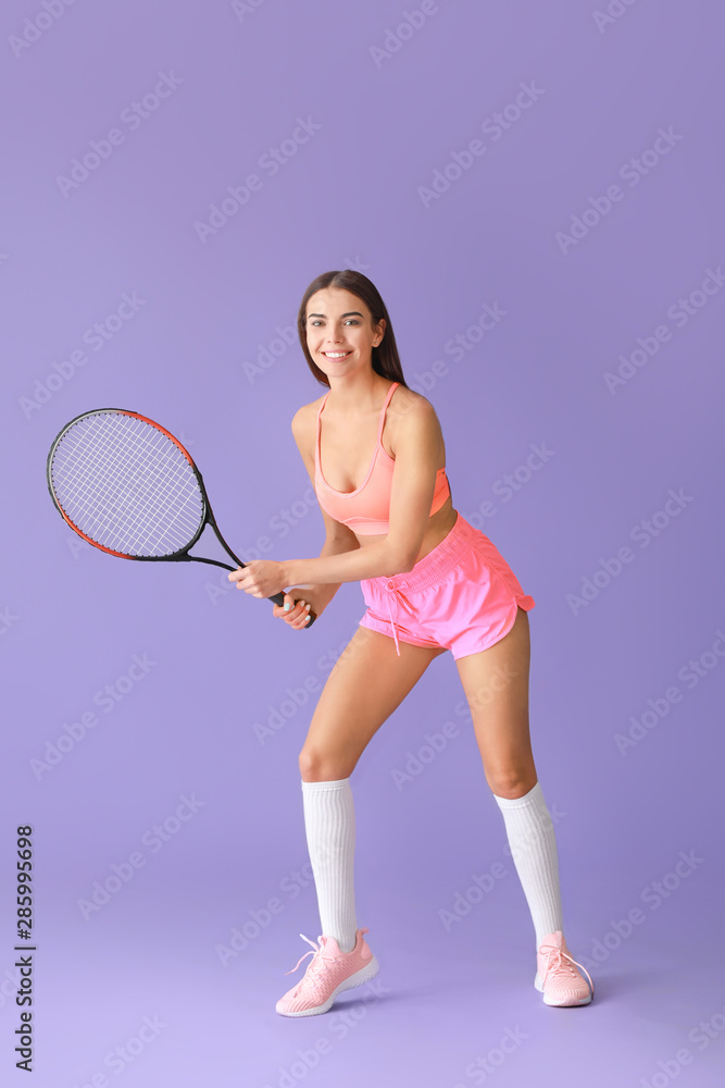 Beautiful tennis player on color background
