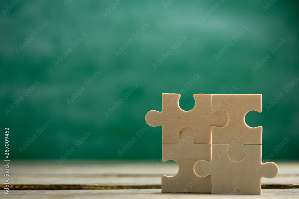 Creative solution for idea - business concept, jigsaw puzzle on the blackboard