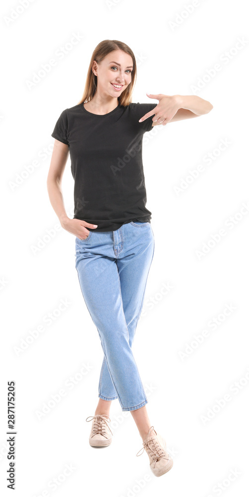 Woman pointing at her t-shirt against white background
