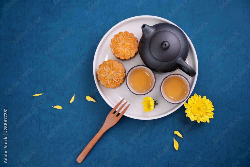 Minimal simplicity layout moon cakes on blue background for Mid-Autumn Festival, creative food desig
