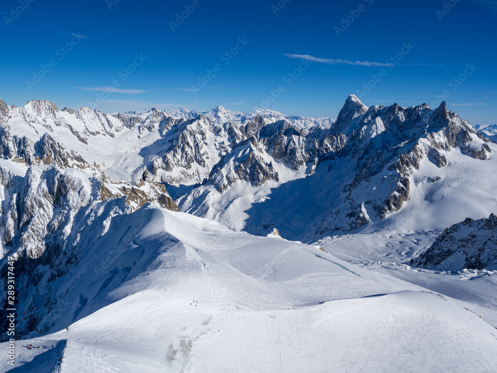 France, january 2018: View on Chamonix Valley from top of Aiguille du Midi summit on a sunny winter 