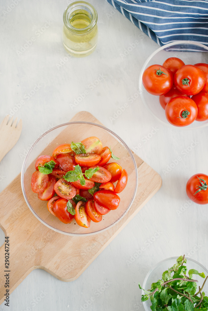 Fresh salad with tomato, mozzarella and basil. Concept for a tasty and healthy appetizer