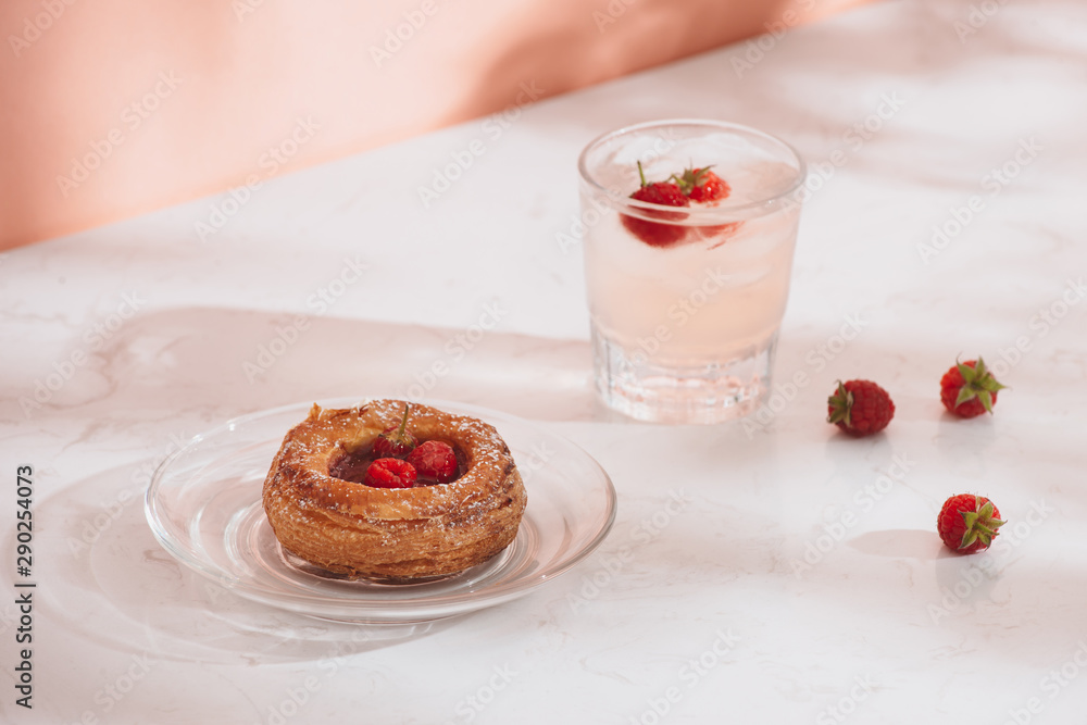 Freshly baked traditional pastry sweet mini danish raspberry and raspberries soda drinks
