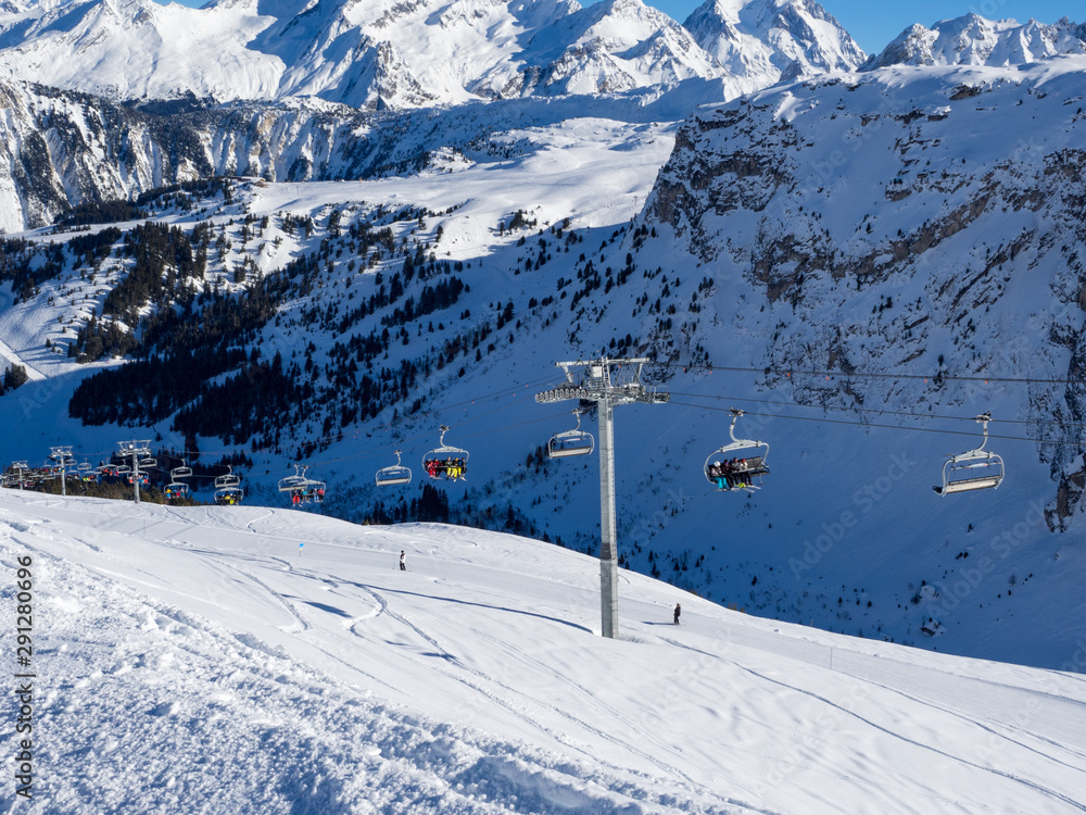 France, february 2019: Skiers on a piste at Courchevel ski resort, French Alps