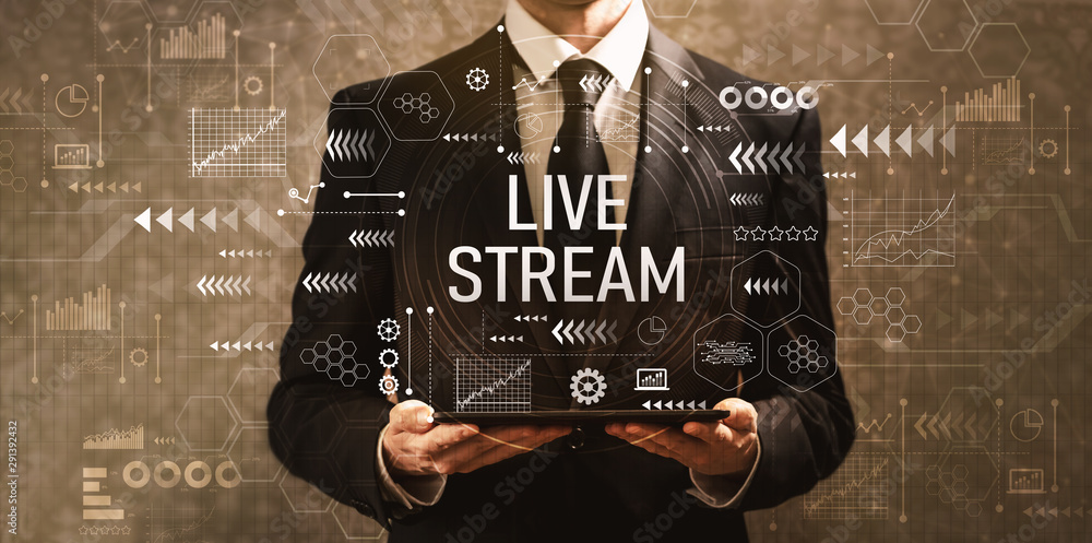 Live stream with businessman holding a tablet computer on a dark vintage background