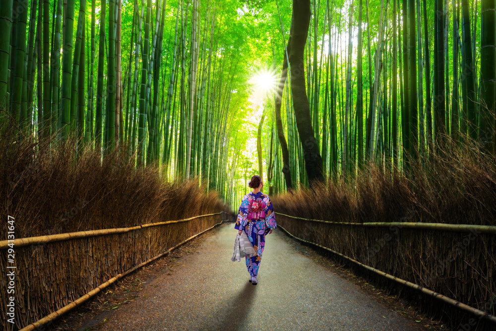 Bamboo forest at Arashiyama with woman in traditional kinono. Japan