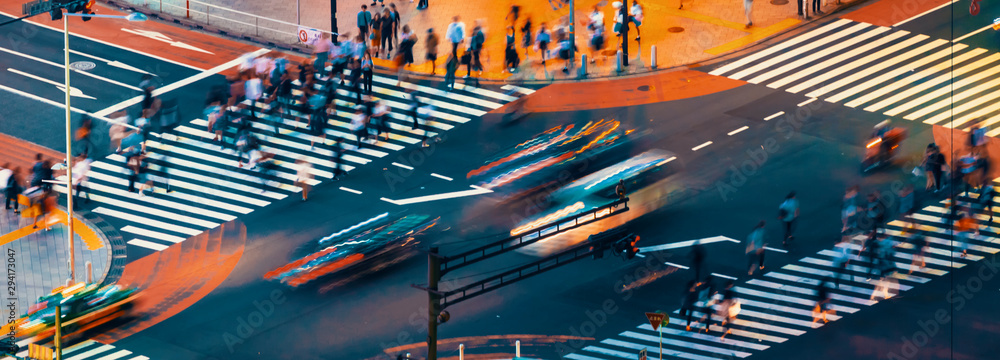 Traffic crosses a busy intersection in Shibuya, Tokyo, Japan