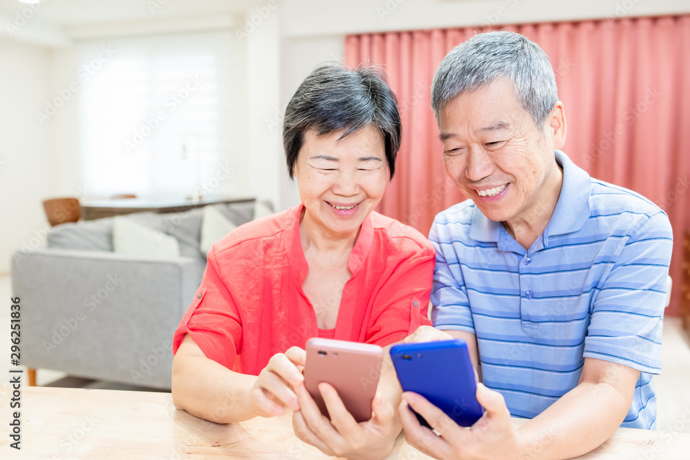 asian eldely couple use smartphone