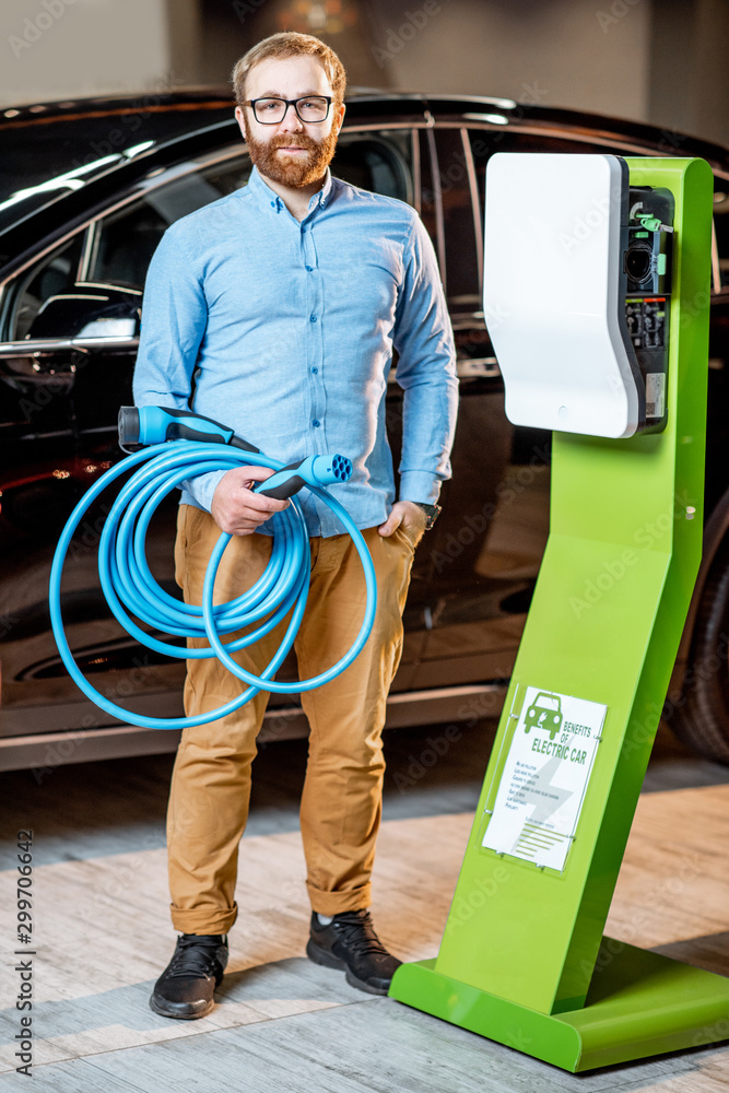 Man choosing car charger at the car dealership