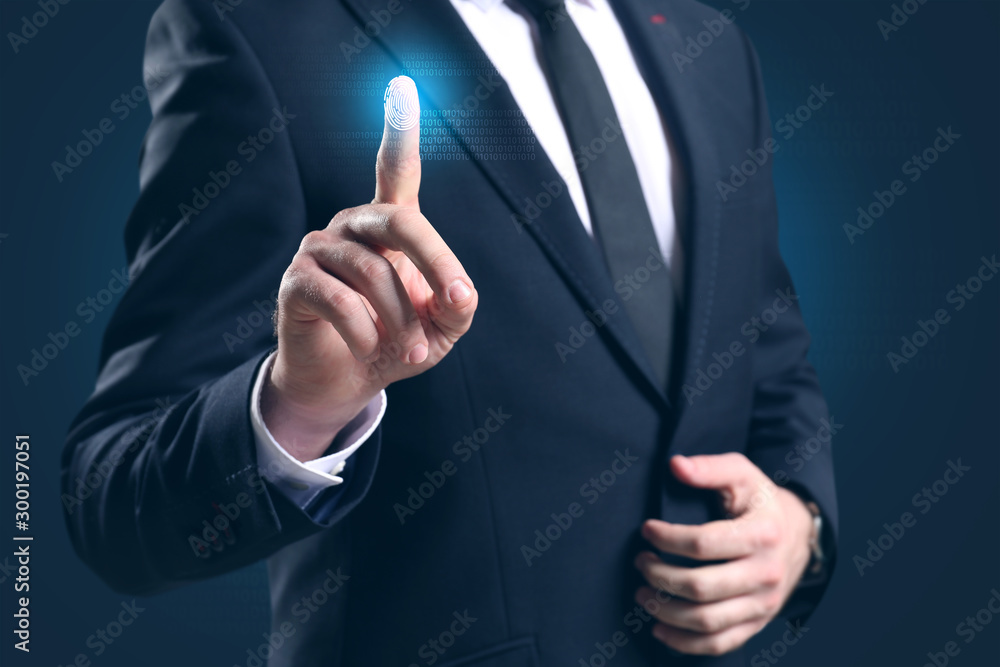 Businessman using fingerprint protection for data access