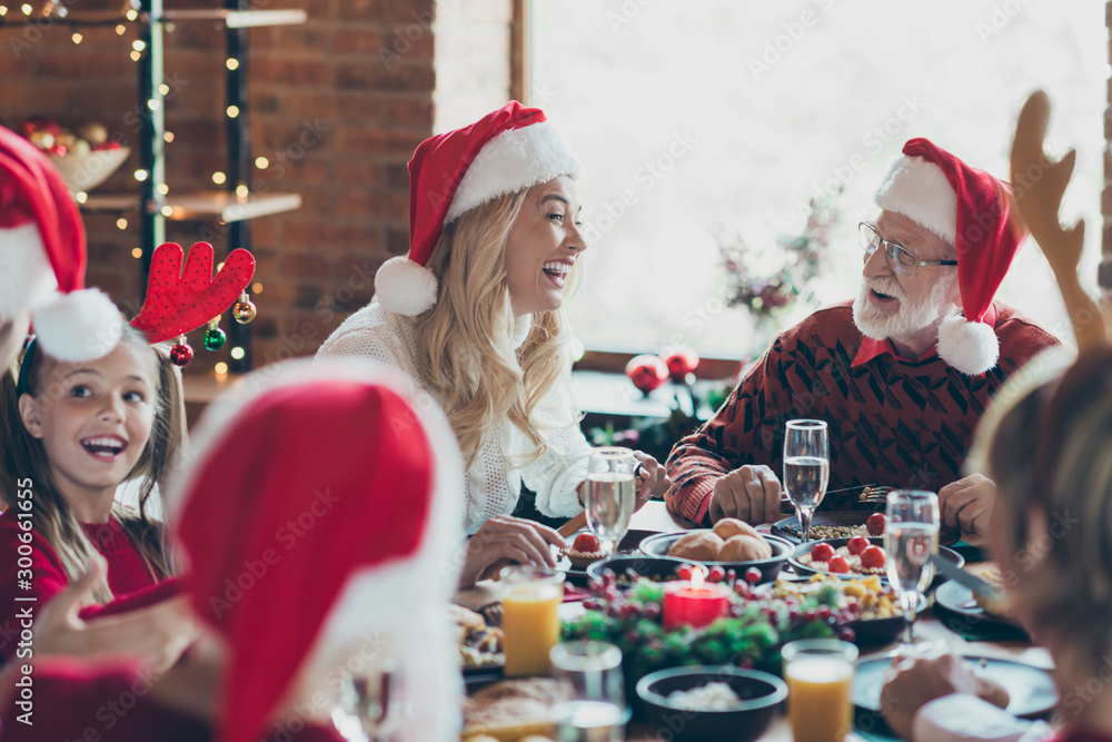 Photo of cheerful positive nice cute big family talking to each other while eating festive food with