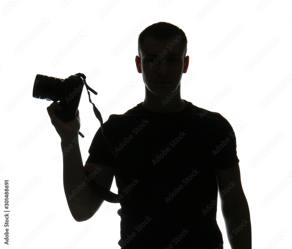 Silhouette of male photographer on white background