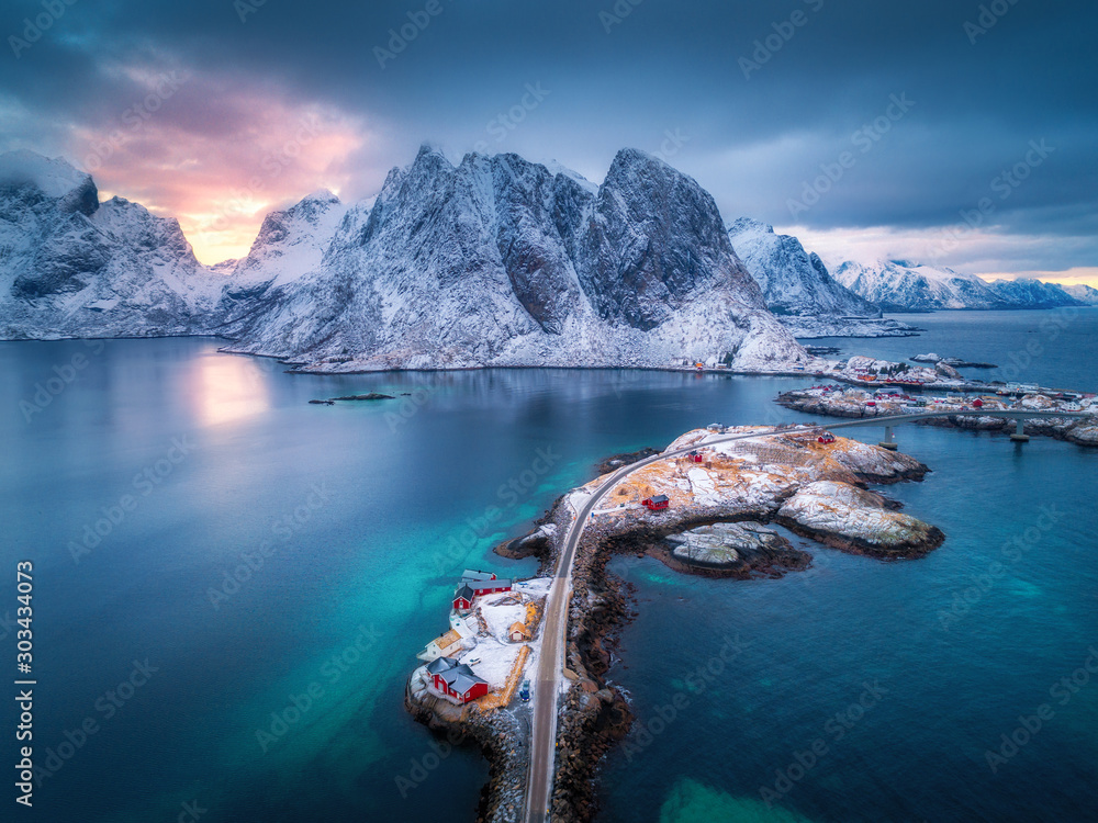 Aerial view of Hamnoy at dramatic sunset in winter in Lofoten islands, Norway. Moody landscape with 