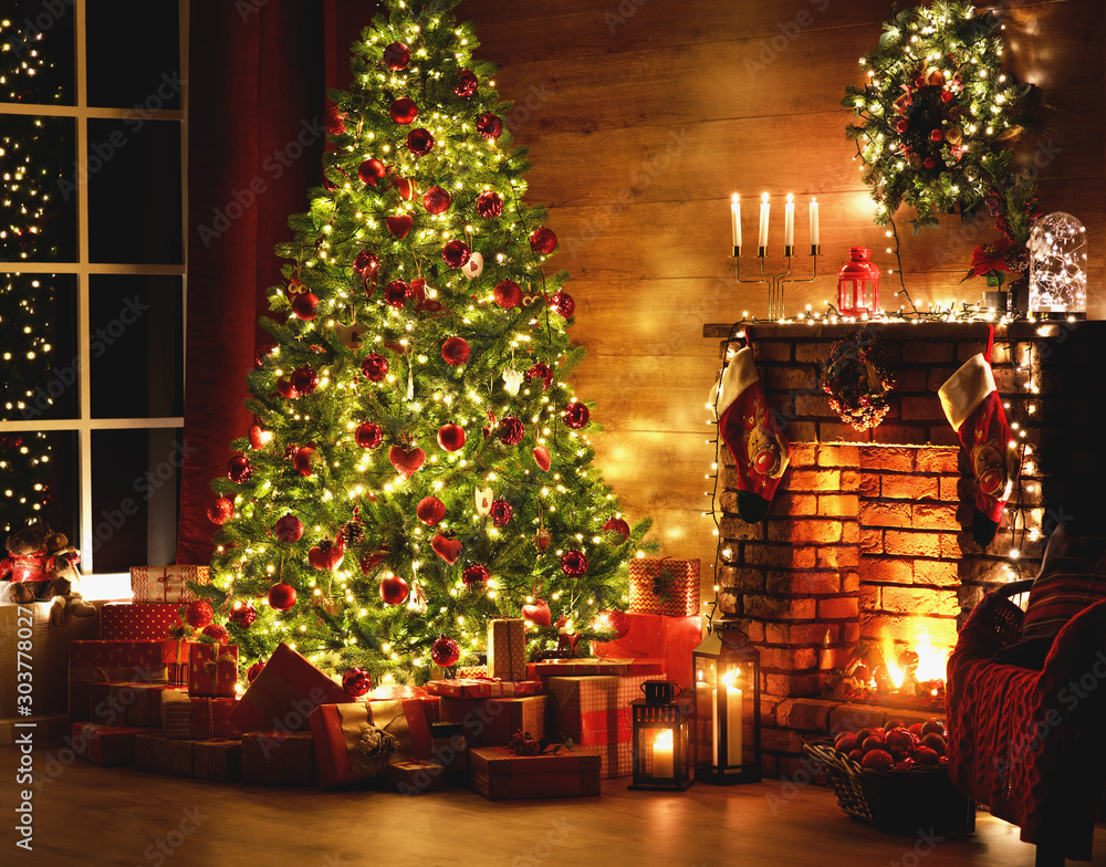 interior christmas. magic glowing tree, fireplace, gifts in  dark