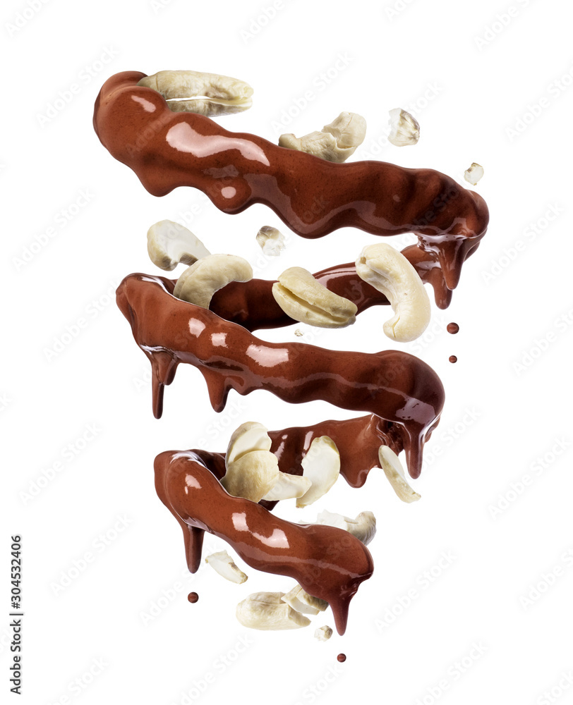Chocolate splashes in spiral shape with crushed cashew nuts, isolated on a white background