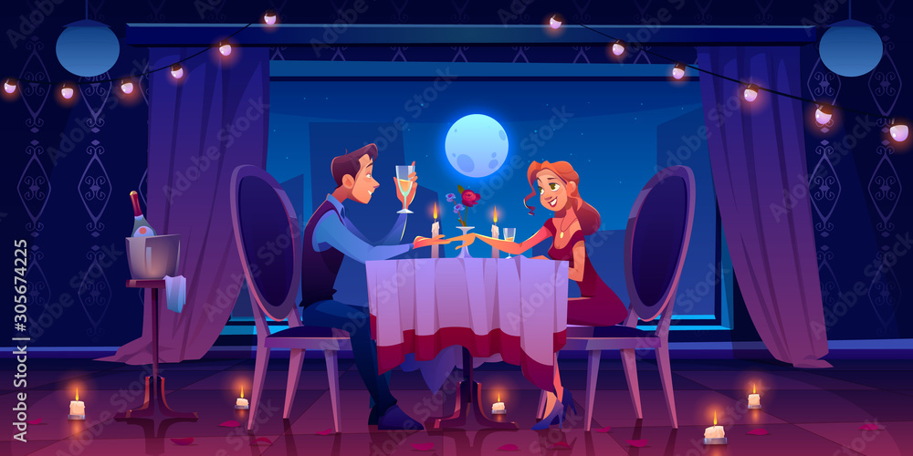 情侣浪漫约会晚餐，男人牵着女人的手坐在w窗黑暗房间的餐桌旁