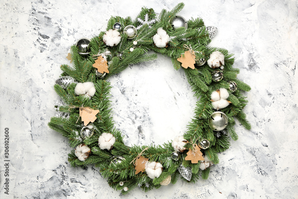 Beautiful Christmas wreath on light background
