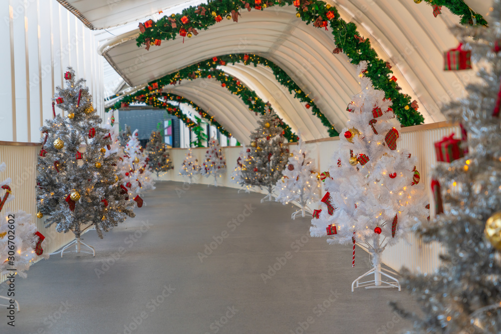 Christmas tree decoration along walkway in city center in Christmas festival of December 2019.
