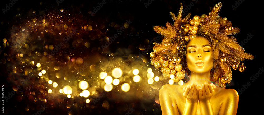 Christmas golden Woman. Winter girl pointing Hand, blowing blinking stars,  Beautiful New Year, Chri