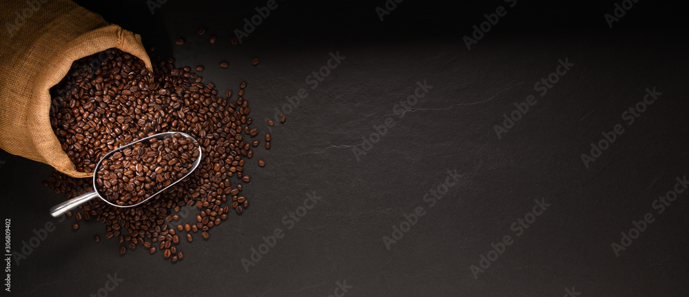  Coffee beans in burlap sack on black background
