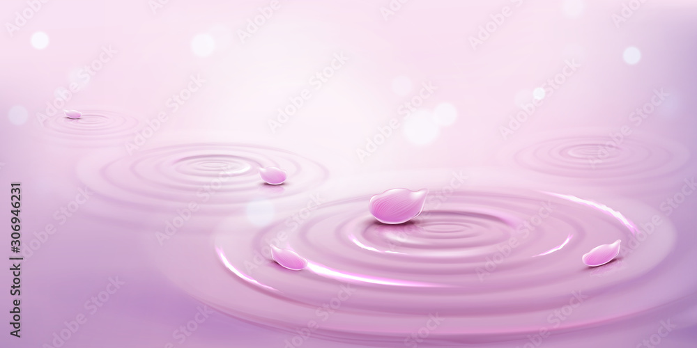 水和粉红色花瓣上的圆圈。带有发散环、漩涡和飞溅物的液体表面。