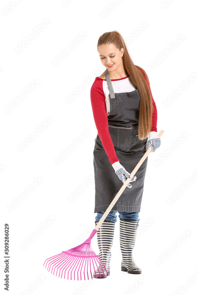 Woman with rake for autumn leaves clean-up on white background