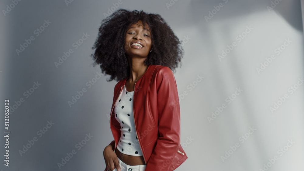 Attractive Black Girl with Lush Curly Hair Posing for a Fashion Magazine Photoshoot. Beautiful Girl 