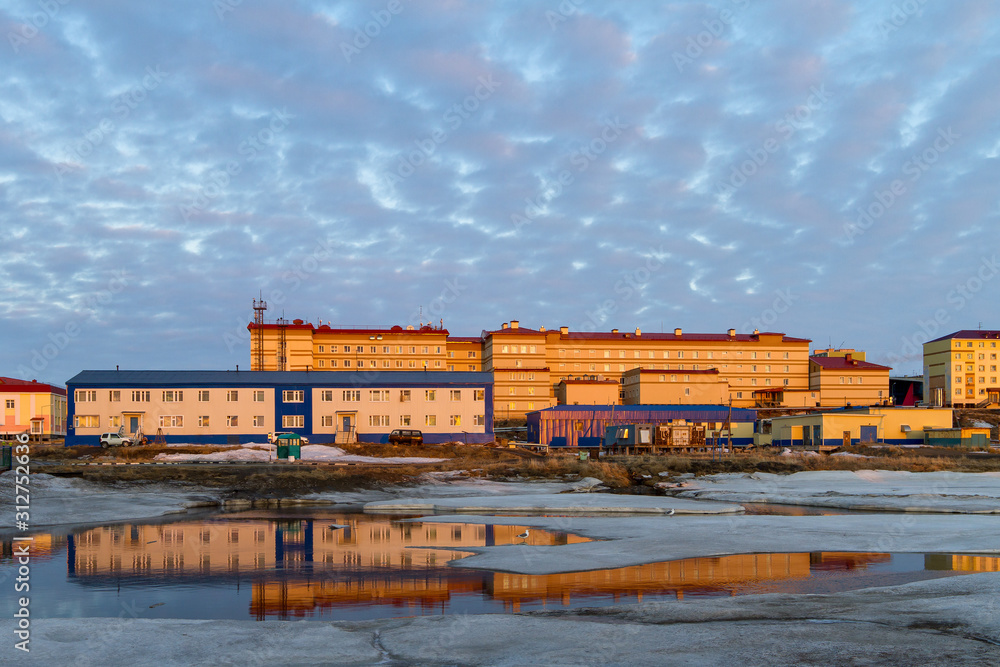 City of Anadyr, Chukotka, Siberia, Far East of Russia. Buildings on the banks of the Kazachka River.