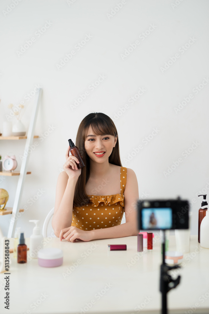 Useful beauty blog. Nice attractive woman giving advice about cosmetics while having her beauty blog