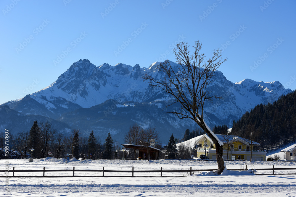 Winter landscape at early morning in small village and ski resort Werfenweng, Austria, Europe.