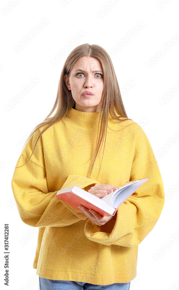 Emotional young woman with book on white background