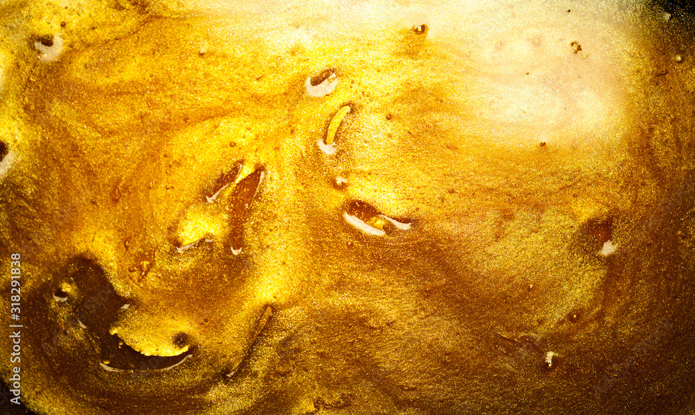 美丽的抽象金色液体背景，美丽的金色背景纹理。金属金色油漆，艺术