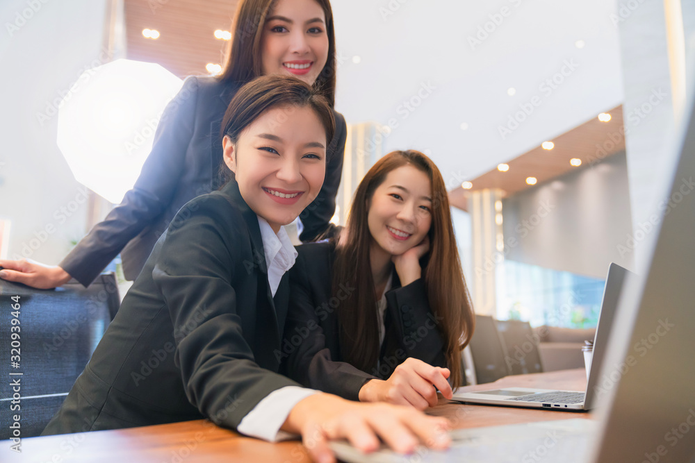 business asian female woman support service group working together with laptop with happiness and ef