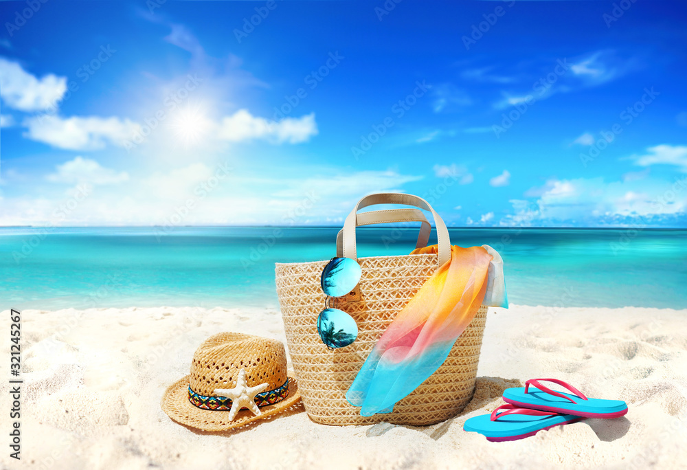 Concept summer holiday. Accessories - bag, straw hat, sunglasses with palm tree reflection, pareo, f