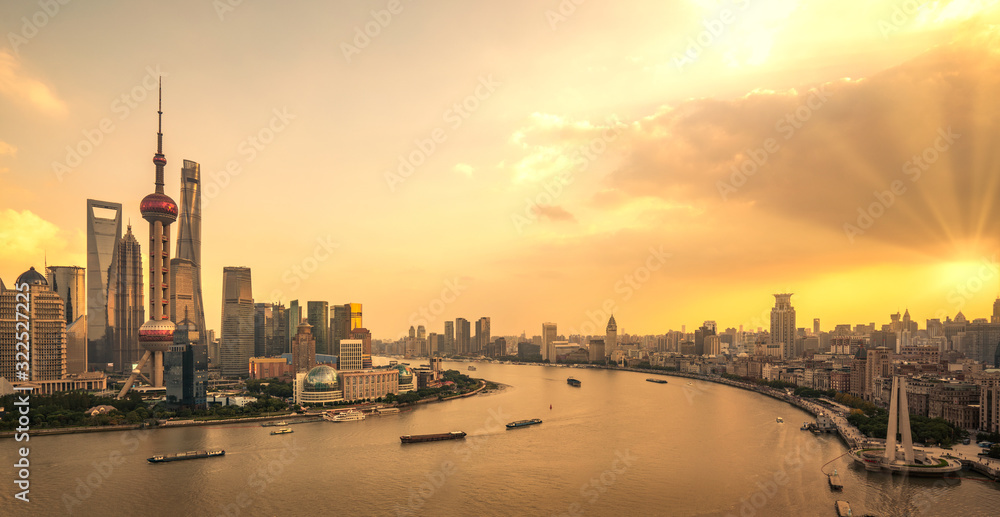 Sunset time in shanghai city withriver and building background