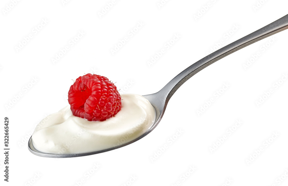 spoon of yogurt cream with raspberry