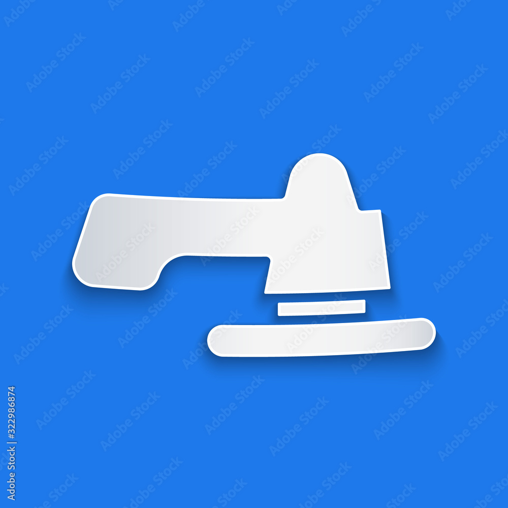 Paper cut Water tap icon isolated on blue background. Paper art style. Vector Illustration