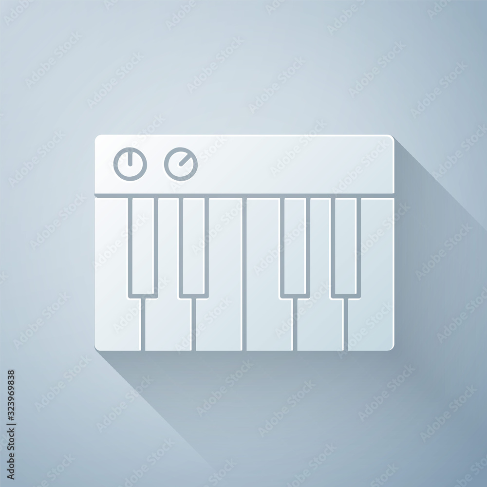Paper cut Music synthesizer icon isolated on grey background. Electronic piano. Paper art style. Vec