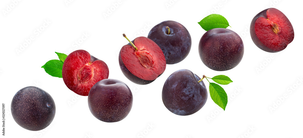 Falling plums with leaves isolated on white background
