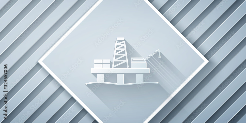 Paper cut Oil platform in the sea icon isolated on grey background. Drilling rig at sea. Oil platfor